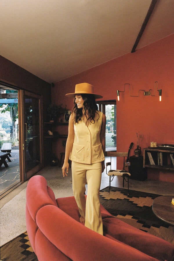 Model wearing a Desert Sun Rancher wool felt hat in a stylish indoor setting