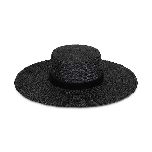 Mira Wide Boater in black, made from wheat straw, featuring a wide brim and black faux suede ribbon.