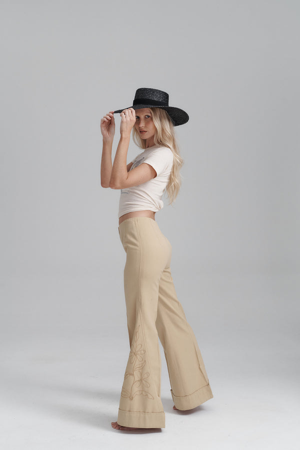 Model wearing the Mira Wide Boater hat, showcasing its style and fit.