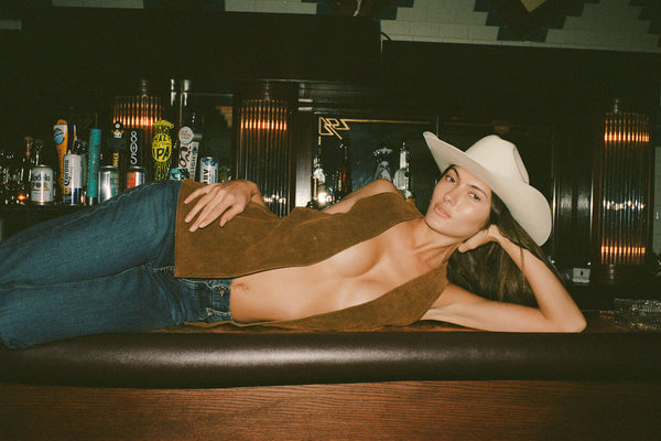 Model wearing The Ridge wool felt cowboy hat in a bar setting
