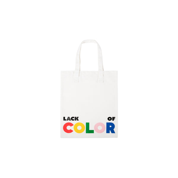 White canvas tote bag with 'LACK of COLOR' printed in colorful letters